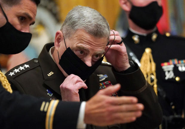 Milley puts his mask back on after U.S. President Donald Trump presented the Medal of Honor in Washington 