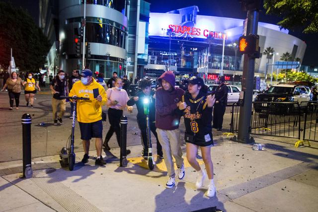 Fans, some rowdy, cheer Lakers win outside Staples Center