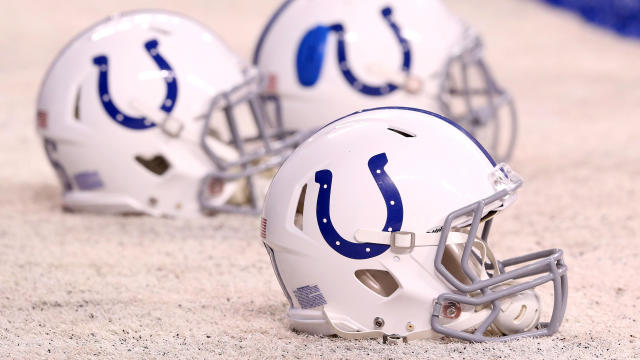 Indianapolis Colts helmets rest on the sidelines during the pregame warmup before the AFC Wild Card game against the Cincinnati Bengals at Lucas Oil Stadium on January 4, 2015, in Indianapolis, Indiana. 