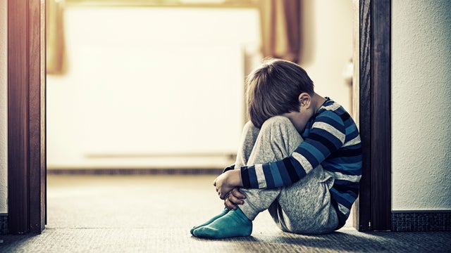 Little boy sitting on the floor 