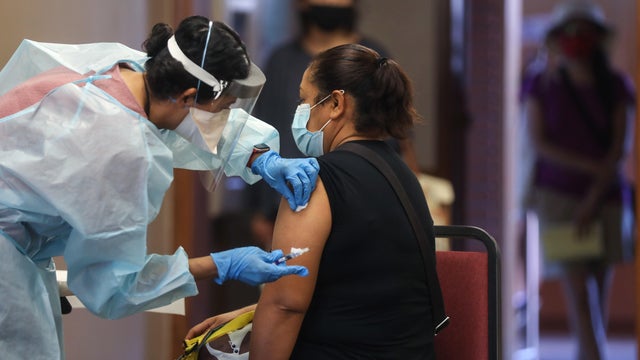Southern California Residents Line Up For Flu Shots At Local Library 