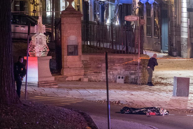 Police officers search an area where multiple people were stabbed in Quebec City 