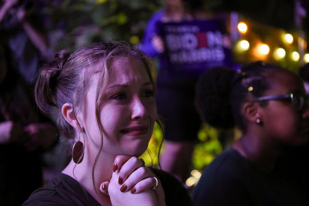 Camille Christian cries as she watches Democratic vice presidential nominee Kamala Harris' speech after media announced she and presidential nominee Joe Biden won the 2020 U.S. presidential election, at Axelrad Beer Garden in Houston, Texas 