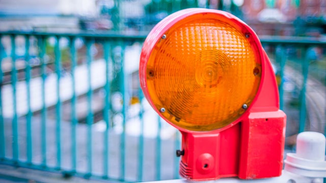 graphicstock-orange-construction-warning-street-barrier-light-on-barricade-road-construction-on-the-streets-of-european-cities-germany-hamburg_SvN1-mq_Z.jpg 