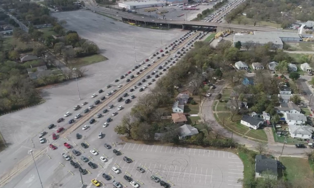 Vehicles lined up for North Texas Food Bank giveaway 