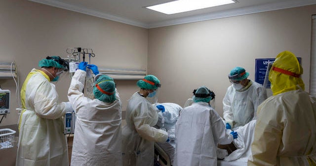 U.S. breaks record of 200,000 new coronavirus cases in a day - CBS News