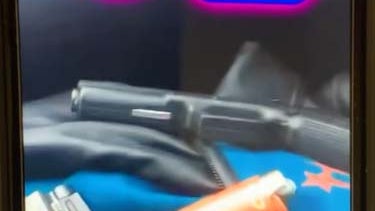 Johnson-social-media-posting-showing-two-handguns.jpg 