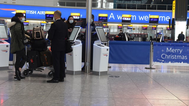 Londoners wait at Heathrow to flee capital as nations bar travelers from UK over new variant of coronavirus 