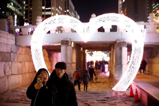 FILE PHOTO: A couple poses for a selfie during New Year’s Eve in Seoul 
