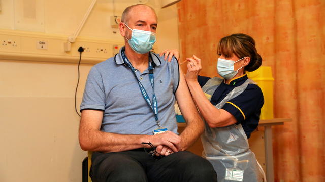 Professor Andrew Pollard receives the Oxford University/AstraZeneca COVID-19 vaccine at the Churchill Hospital in Oxford 