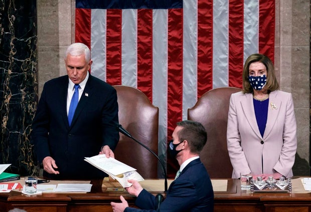 Vice President Mike Pence and House Speaker Nancy Pelosi preside over a Joint session of Congress to certify the 2020 Electoral College results on Jan. 6, 2021.