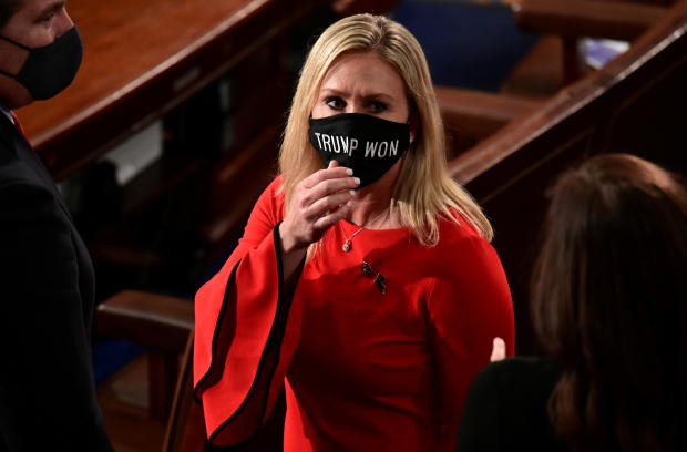 U.S. Rep. Marjorie Taylor Greene (R-GA) wears a "Trump Won" face mask as she arrives to take her oath of office as a member of the 117th Congress in Washington 
