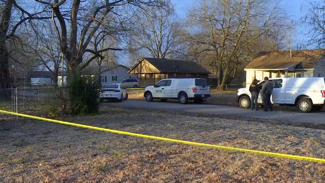 Crews work the scene after a deadly shooting at a house in Muskogee, Oklahoma, February 2, 2021. 