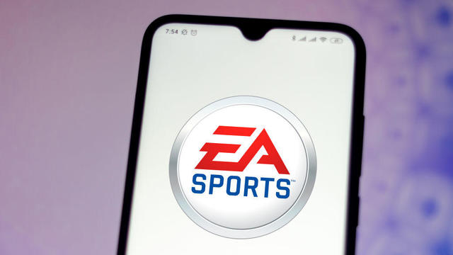 In this photo illustration the EA Sports logo seen displayed 
