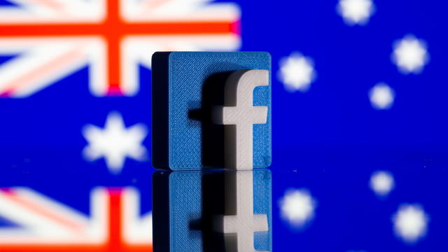 FILE PHOTO: A 3D-printed Facebook logo is seen in front of a displayed Australian flag in this illustration photo 