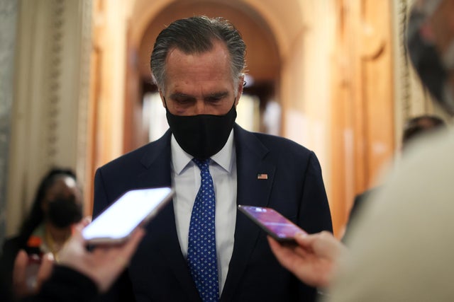 U.S. Senator Romney speaks with reporters about potential efforts to raise the minimum wage at the U.S. Capitol in Washington 