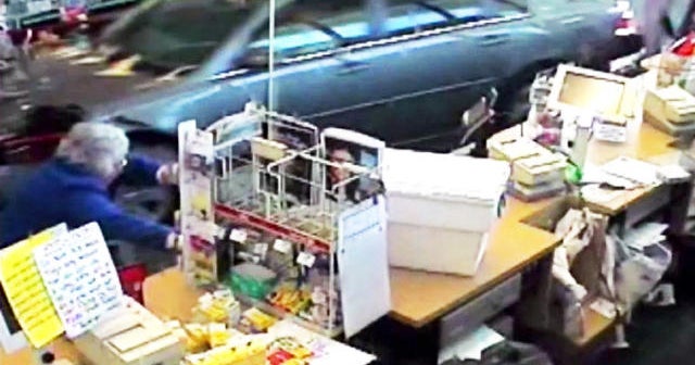 Elderly woman smashes car through CVS – caught on tape - CBS News