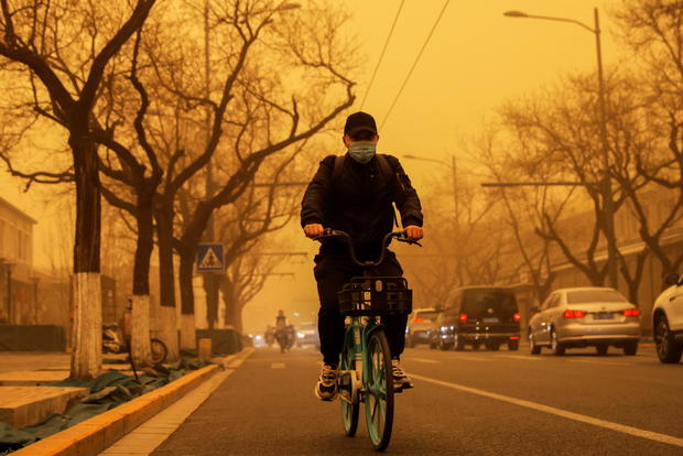 Sandstorm during morning rush hour in Beijing, China 