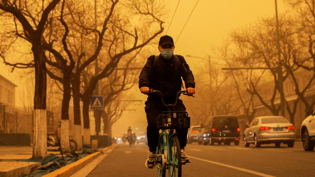 Sandstorm during morning rush hour in Beijing, China 