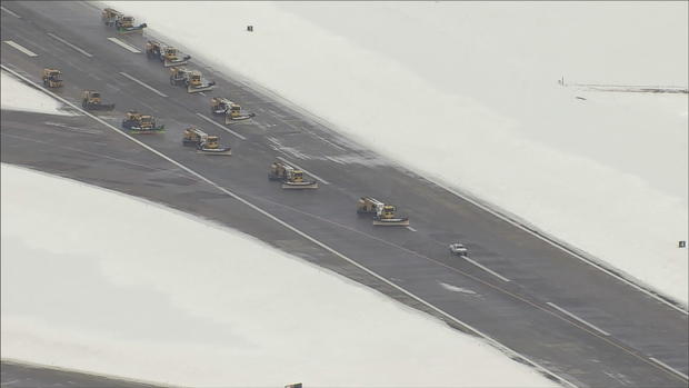 dia runways snow blizzard plows 