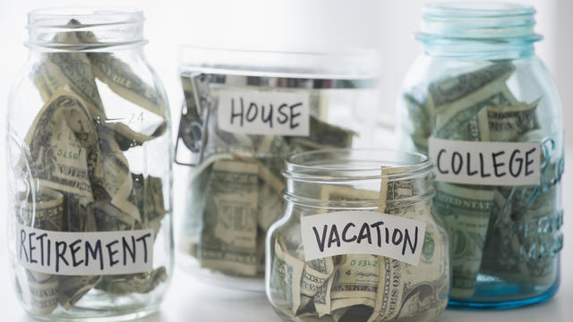 Close up of savings jars with money 