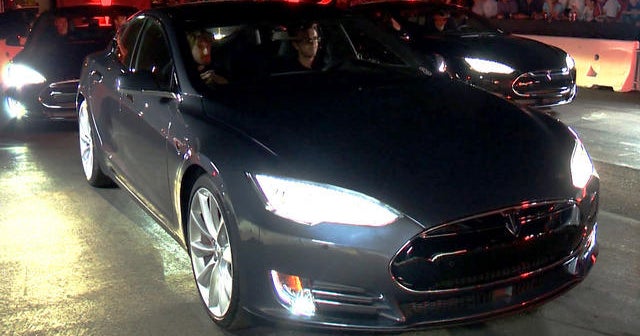 Tesla unveils sleek new features for electric cars - CBS News