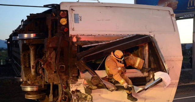 Truck driver arrested after dozens hurt in California train crash - CBS ...