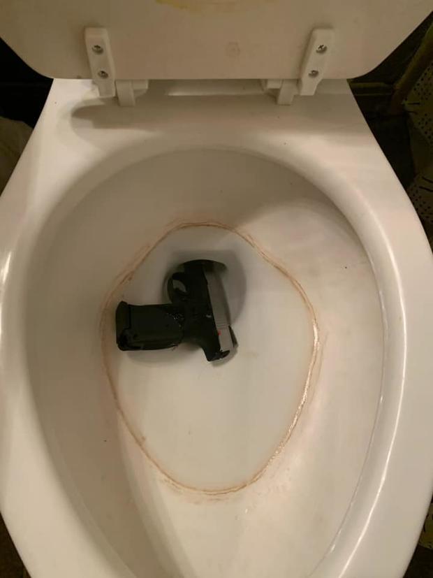 gun in toilet 