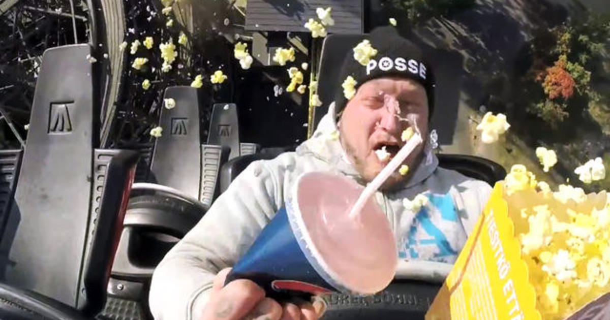 Man tries to eat and drink on a roller coaster