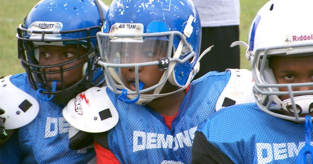 At what age is football safe for kids? CBS News