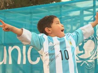 Five-year-old Murtaza Ahmadi pictured wearing homemade 'Messi 10