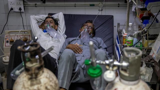 FILE PHOTO: Patients suffering from the coronavirus disease (COVID-19) get treatment at the casualty ward in Lok Nayak Jai Prakash (LNJP) hospital, amidst the spread of the disease in New Delhi 