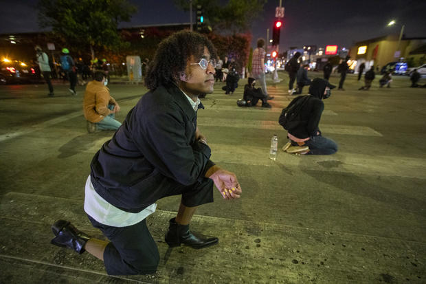 Protesters Kneel In Fairfax Intersection After Derek Chauvin Found Guilty 