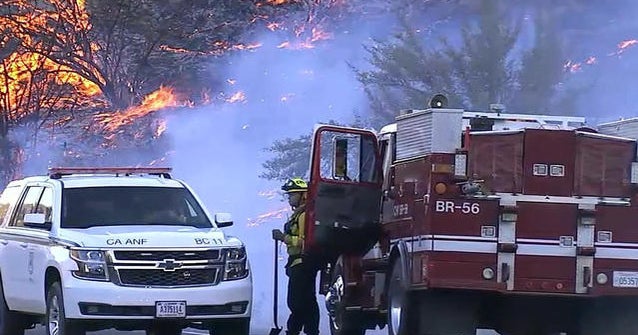 Firefighters struggle to contain enormous California wildfire - CBS News