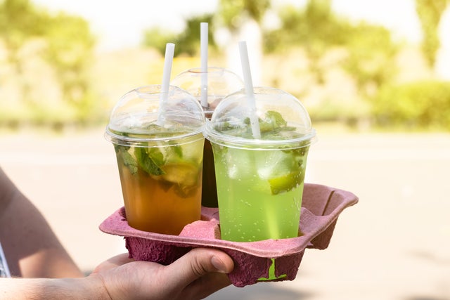 alcohol to go take out drinks Assortment of Colored Berry Take Away Beverages in plastic cup. 