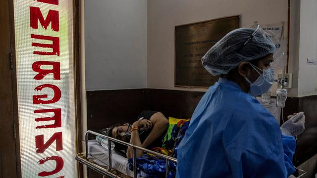 A patient suffering from the coronavirus disease (COVID-19) receives treatment inside the emergency ward at Holy Family hospital in New Delhi 