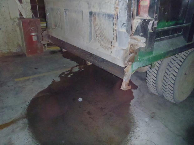 release of hazardous wastewater under truck in ash conveyor building 