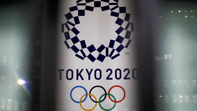 FILE PHOTO: The logo of Tokyo 2020 Olympic Games is seen through signboards, in Tokyo 