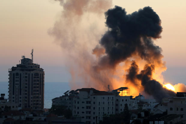 Smoke and flames rise during Israeli airstrikes as cross-border violence between the Israeli military and Palestinian militants continues in Gaza City May 14, 2021. 