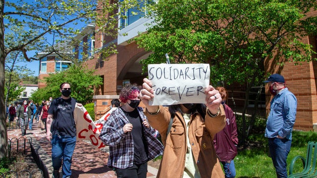Penn State graduate student, Ernest Tjia holds a "solidarity 