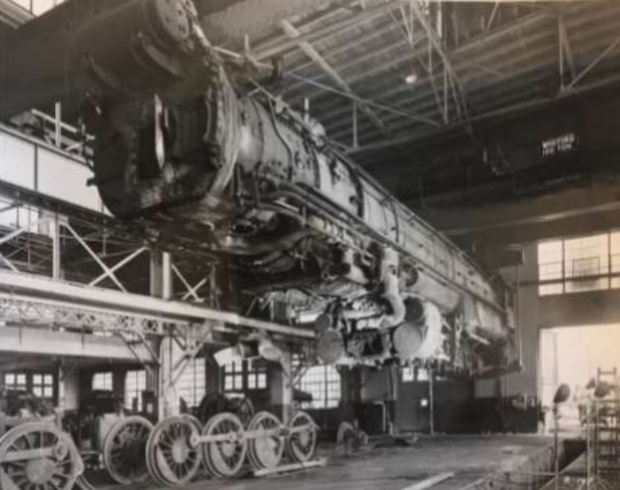 CDOT Burnham Yard 5 (steam locomotive lifted from its wheel in 1924 Backshop, credit Stephen F. Hart Library and Research Center, History Colorado) 