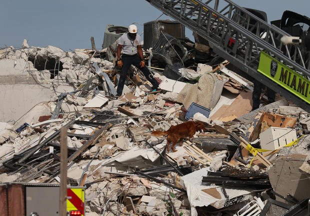 Search and rescue worker in rubble of collapsed building 