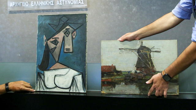 The paintings "Woman's Head" by Pablo Picasso, and "Mill" by Piet Mondrian are displayed at the Ministry of Citizen Protection in Athens 