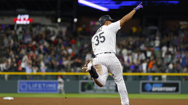 Elias Diaz of the Colorado Rockies celebrates with Brendan Rodgers