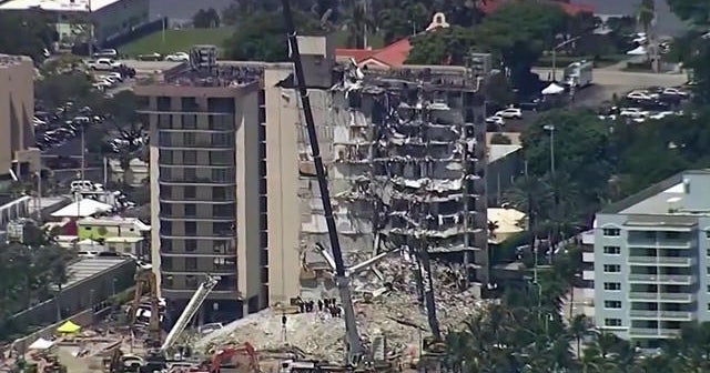 Florida condo set for demolition before tropical storm closes in - CBS News