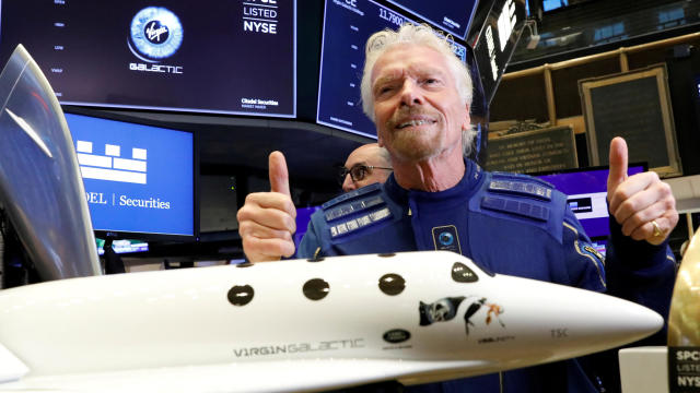 Sir Richard Branson with a model of Virgin Galactic spaceplane 