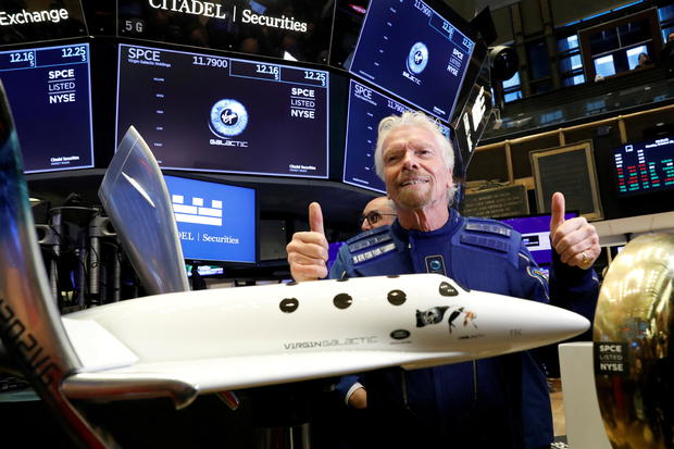 FILE PHOTO: Sir Richard Branson poses on floor of New York Stock Exchange (NYSE) ahead of Virgin Galactic (SPCE) trading in New York 