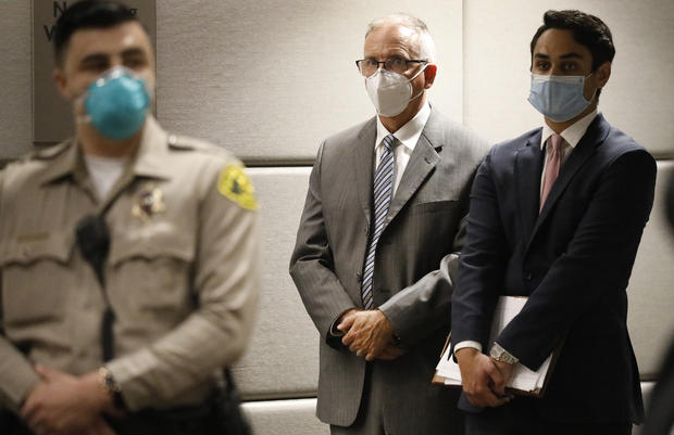 UCLA Gynecologist Dr. James Heaps appears in Los Angeles Superior Court listening as Deputy DA Morgan Mallory, right, addresses the Judge. Heaps was taken into custody after additional charges were filed against him this morning. 