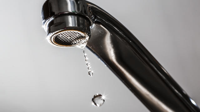 Close-Up Of Water Dripping From Faucet 