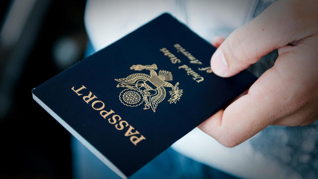 Close-Up Of Man Holding Passport 